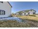 Rear exterior of home shows a large lot with a patio and well-maintained lawn at 16650 Shadow Wood Ct, Hudson, CO 80642