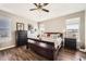 Bedroom featuring a comfortable bed, ceiling fan, and dresser at 16650 Shadow Wood Ct, Hudson, CO 80642