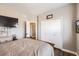 Bedroom featuring closet and TV at 16650 Shadow Wood Ct, Hudson, CO 80642