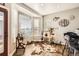 Bright breakfast nook with bay window, wood floors, and fun decor at 16650 Shadow Wood Ct, Hudson, CO 80642