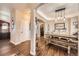 Charming dining area featuring stylish lighting and a spacious table at 16650 Shadow Wood Ct, Hudson, CO 80642