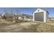 Exterior view of a two-story home with attached garage and manicured landscaping at 16650 Shadow Wood Ct, Hudson, CO 80642