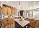 Bright kitchen with an island, stainless steel appliances, and ample counter space at 16650 Shadow Wood Ct, Hudson, CO 80642