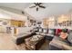 Inviting living room featuring a large sectional sofa and hardwood floors at 16650 Shadow Wood Ct, Hudson, CO 80642