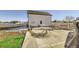 Back patio featuring an outdoor table and chairs on a concrete slab at 16650 Shadow Wood Ct, Hudson, CO 80642