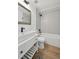 Modern bathroom features a shower over tub with geometric pattern tile surround at 9366 Clermont Dr, Thornton, CO 80229