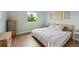 Serene bedroom featuring hardwood floors, natural light, and neutral tones at 9366 Clermont Dr, Thornton, CO 80229