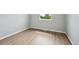 Well lit bedroom with natural light, wood floors, and neutral paint at 9366 Clermont Dr, Thornton, CO 80229