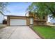 Charming two-story home with a well-maintained lawn and a spacious two-car garage at 9366 Clermont Dr, Thornton, CO 80229