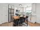 Modern kitchen featuring stainless steel appliances, granite countertops, and a butcher block island at 9366 Clermont Dr, Thornton, CO 80229
