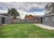 Lush backyard features mature trees, privacy fence, and detached structure at 3320 N Madison St, Denver, CO 80205