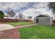 Large backyard with detached structure, wooden fence, and well-manicured lawn at 3320 N Madison St, Denver, CO 80205
