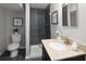 Bathroom featuring a walk-in shower, modern fixtures, vanity, and natural light at 3320 N Madison St, Denver, CO 80205