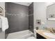 Bathroom featuring modern tiling, a soaking tub, and granite vanity at 3320 N Madison St, Denver, CO 80205
