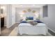 Cozy bedroom with plush white bedding, decorative wall hangings, and ample lighting at 3320 N Madison St, Denver, CO 80205