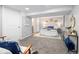 Bright bedroom boasts neutral color palette, plush carpet, and ample natural light at 3320 N Madison St, Denver, CO 80205