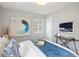 Cozy bedroom with natural light, stylish decor, and hardwood floors at 3320 N Madison St, Denver, CO 80205