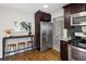 Bright kitchen with stainless steel refrigerator, stainless steel appliances, and counter seating at 3320 N Madison St, Denver, CO 80205
