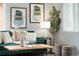 Cozy living room detail showcasing plush green sofa, stylish pillows, and modern accents at 3320 N Madison St, Denver, CO 80205