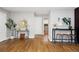Spacious living room featuring hardwood floors, decor, and access to other rooms at 3320 N Madison St, Denver, CO 80205