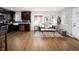 Living space with dark kitchen cabinets, lots of light, and comfortable green sofa at 3320 N Madison St, Denver, CO 80205