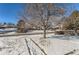 House on a snow-covered lot, residential neighborhood at 994 S Vivian Ct, Lakewood, CO 80228