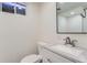 Basement bathroom with white vanity, quartz countertop and subway tile shower at 994 S Vivian Ct, Lakewood, CO 80228