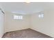 Bright, spacious basement bedroom with carpet and neutral walls at 994 S Vivian Ct, Lakewood, CO 80228