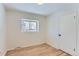 Well-lit bedroom with hardwood floors and ample closet space at 994 S Vivian Ct, Lakewood, CO 80228