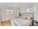 Bright bedroom with a king-size bed and plenty of natural light at 994 S Vivian Ct, Lakewood, CO 80228