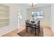 Dining room with hardwood floors, built in shelving and light colored walls at 994 S Vivian Ct, Lakewood, CO 80228