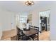 Bright dining room with hardwood floors and view into kitchen at 994 S Vivian Ct, Lakewood, CO 80228