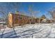 Ranch style home exterior with a snow-covered backyard at 994 S Vivian Ct, Lakewood, CO 80228