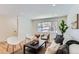 Bright living room with hardwood floors and modern furniture at 994 S Vivian Ct, Lakewood, CO 80228