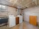 Laundry area with washer, dryer, and storage cabinet at 3412 Zuni St, Denver, CO 80211