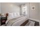 Bright bedroom with a comfortable bed and neutral walls at 3412 Zuni St, Denver, CO 80211