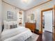 Cozy bedroom with a mid-century modern dresser and plenty of natural light at 3412 Zuni St, Denver, CO 80211