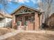 Charming brick home with a covered front porch at 3412 Zuni St, Denver, CO 80211