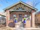 Brick home with a classic front porch and landscaping at 3412 Zuni St, Denver, CO 80211