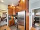 Bright kitchen with stainless steel appliances and rich wood cabinets at 3412 Zuni St, Denver, CO 80211