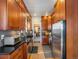 View of kitchen with stainless steel appliances and wood cabinets at 3412 Zuni St, Denver, CO 80211