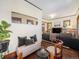 Living area with hardwood floors and built-in shelving at 3412 Zuni St, Denver, CO 80211