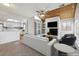 Spacious living room features a stone fireplace and vaulted ceiling with wood beams at 12602 E Warren Dr # D, Aurora, CO 80014