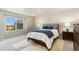 Serene bedroom with a comfortable bed, a large window, and stylish decor at 6150 Sugarloaf St, Brighton, CO 80601