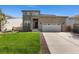 Charming two-story home featuring a stone facade and a well-manicured lawn at 6150 Sugarloaf St, Brighton, CO 80601