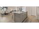 Modern kitchen island featuring stainless steel appliances and an open concept floor plan at 6150 Sugarloaf St, Brighton, CO 80601