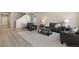 Comfortable living room with hardwood floors, a plush rug, and stylish leather furniture at 6150 Sugarloaf St, Brighton, CO 80601