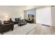 Inviting living room featuring a comfortable sofa, a coffee table, and bright natural light at 6150 Sugarloaf St, Brighton, CO 80601