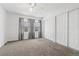Bedroom with carpet, ceiling fan and large closets at 9050 Zephyr Ct, Broomfield, CO 80021