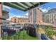 Cozy balcony with outdoor seating and a grill, offering urban views and a relaxing atmosphere at 1735 19Th St # 5B, Denver, CO 80202